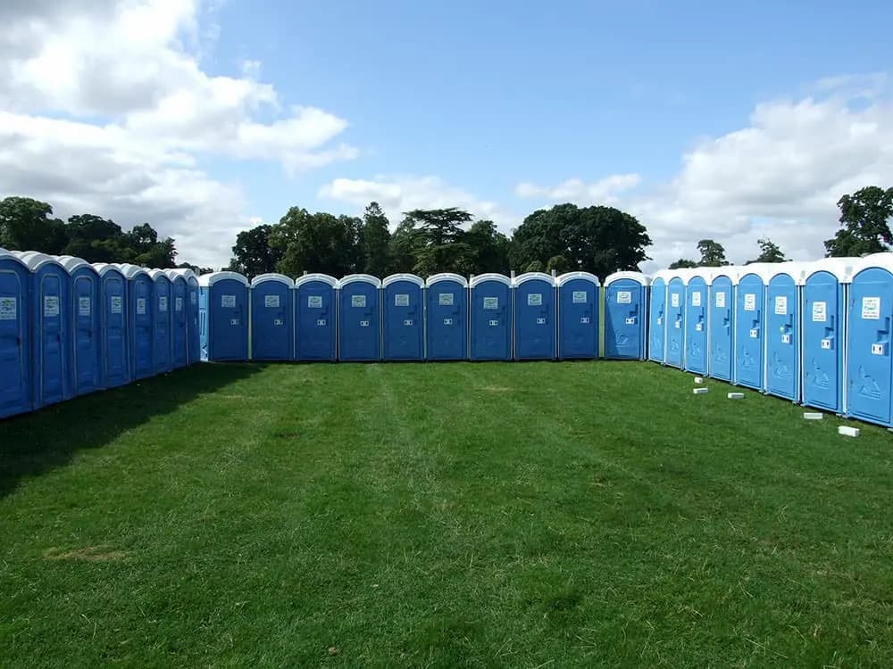 Portable event toilets for hire in a field