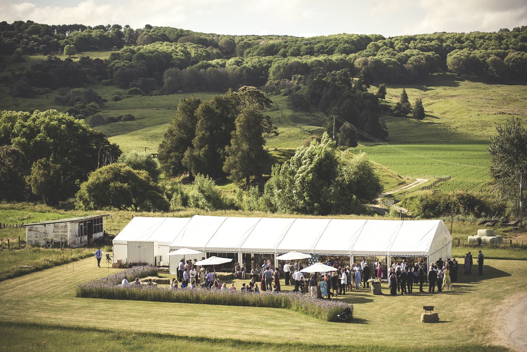 large function marquee with added catering marquee and chill trailer, plenty of guests enjoying the outside space